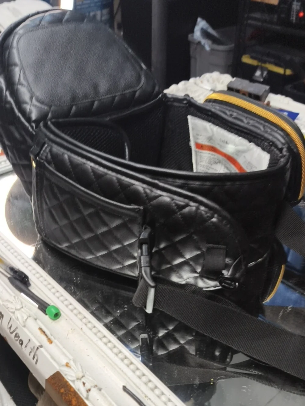 a MINT Tushbaby Quilted Vegan Black Leather Bag. Excellent.